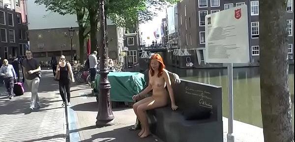  Pretty redhead walking naked in Amsterdam